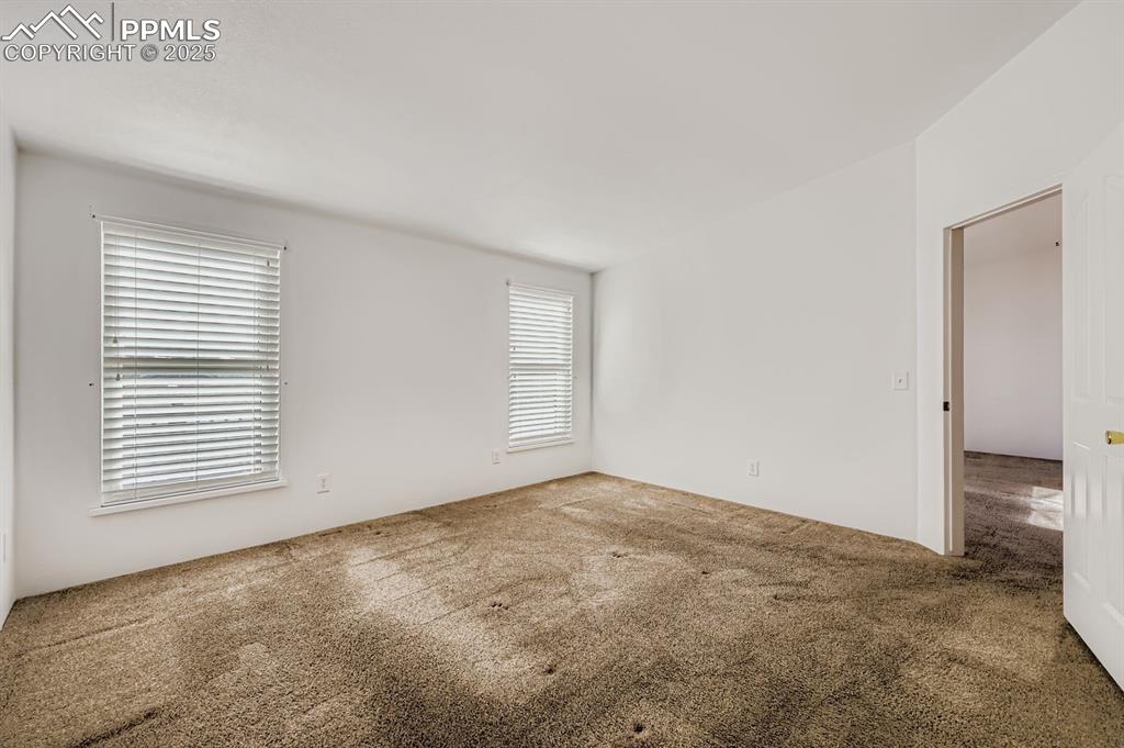 Unfurnished room featuring carpet