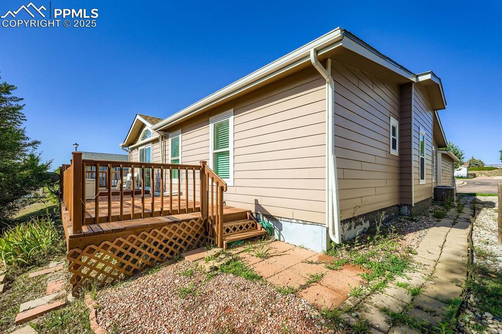 View of side of property with a deck