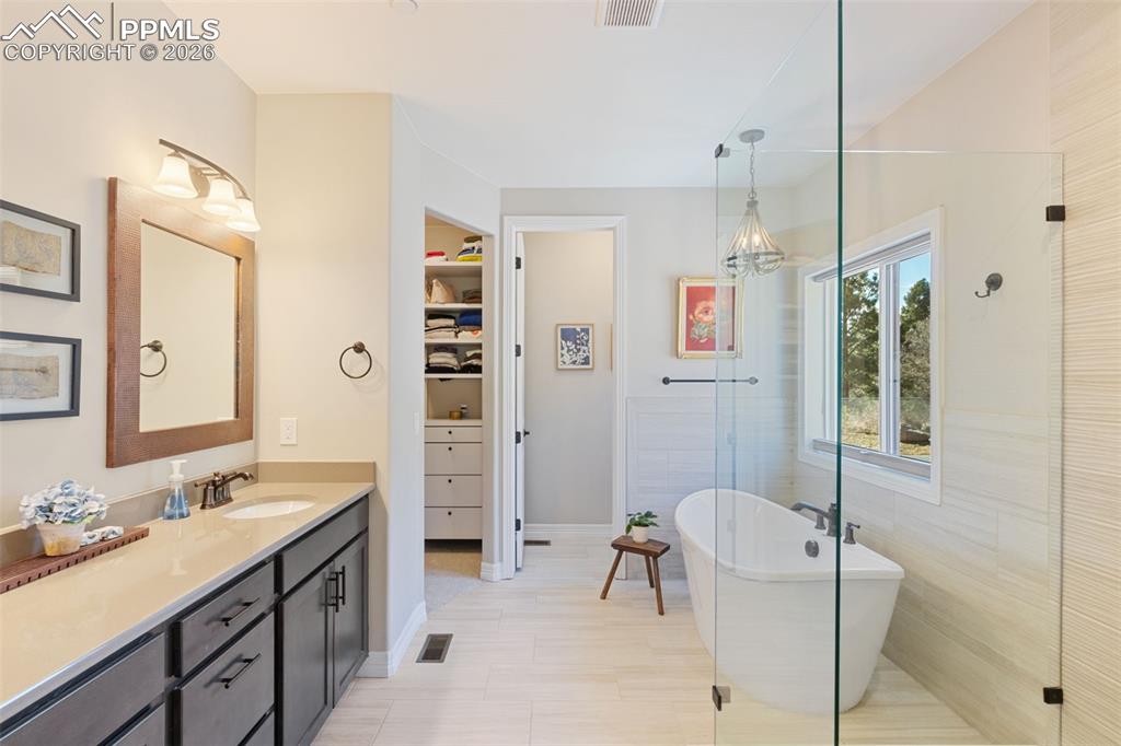 The primary en-suite is laid out for dual daily routines, featuring dual vanities and a walk-in closet
