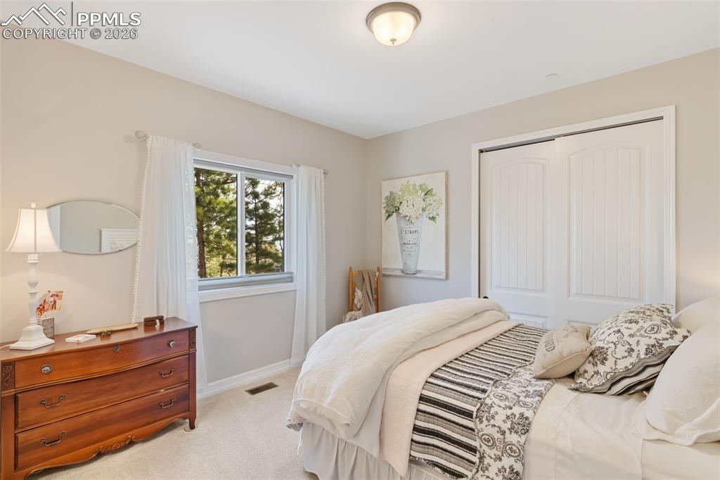 The first guest suite provides a luminous, welcoming environment with generous proportions, ensuring family or overnight visitors enjoy their own private, comfortable haven
