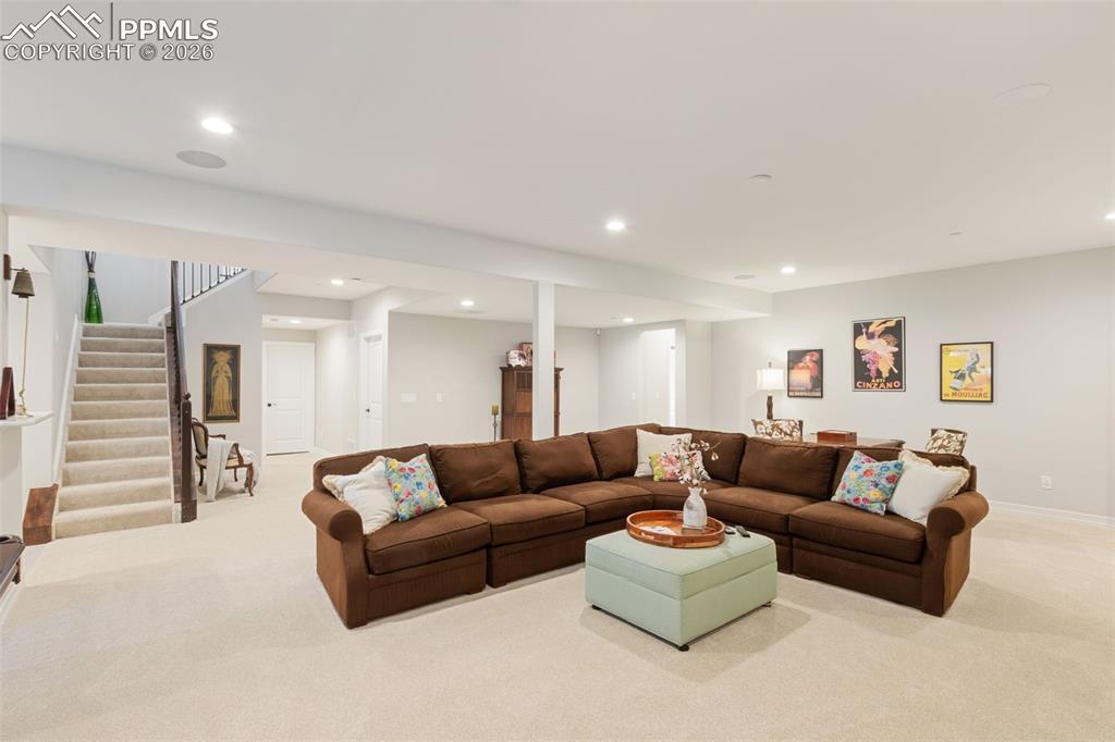 The finished basement expands the home's living footprint dramatically, offering a massive open-concept living space that acts as a secondary, casual family room