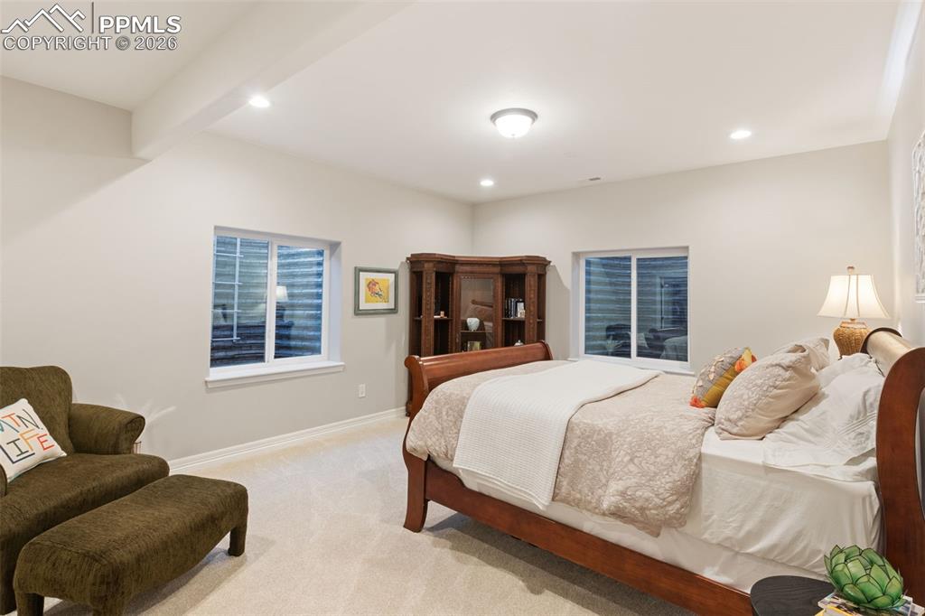 Thoughtful placement of egress windows ensures safety while flooding the space with natural light, elevating the comfort of the lower-level living quarters
