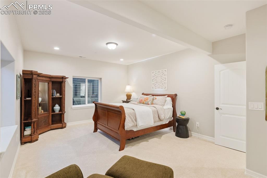 Another generously sized suite demonstrates the home's capacity to comfortably host multiple generations under one roof without compromising on individual privacy
