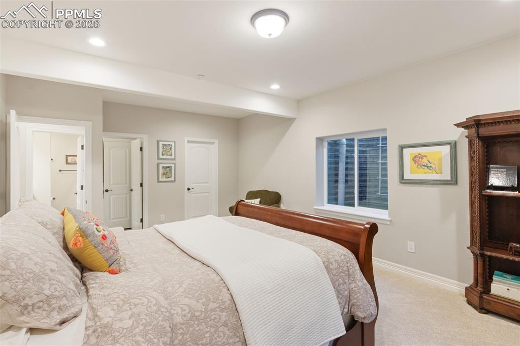 This basement bedroom serves as ideal private quarters for in-laws or older children, offering substantial space and abundant light
