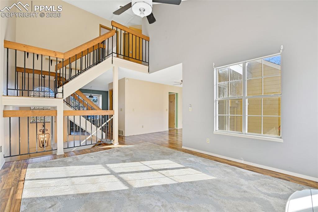 Living/Great Room With Views Of Staircase And Into The Formal Dining Room