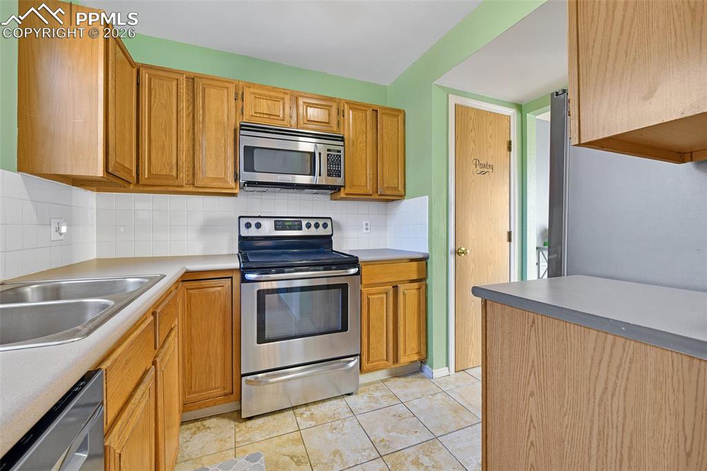 Kitchen With View Of Pantry Door
