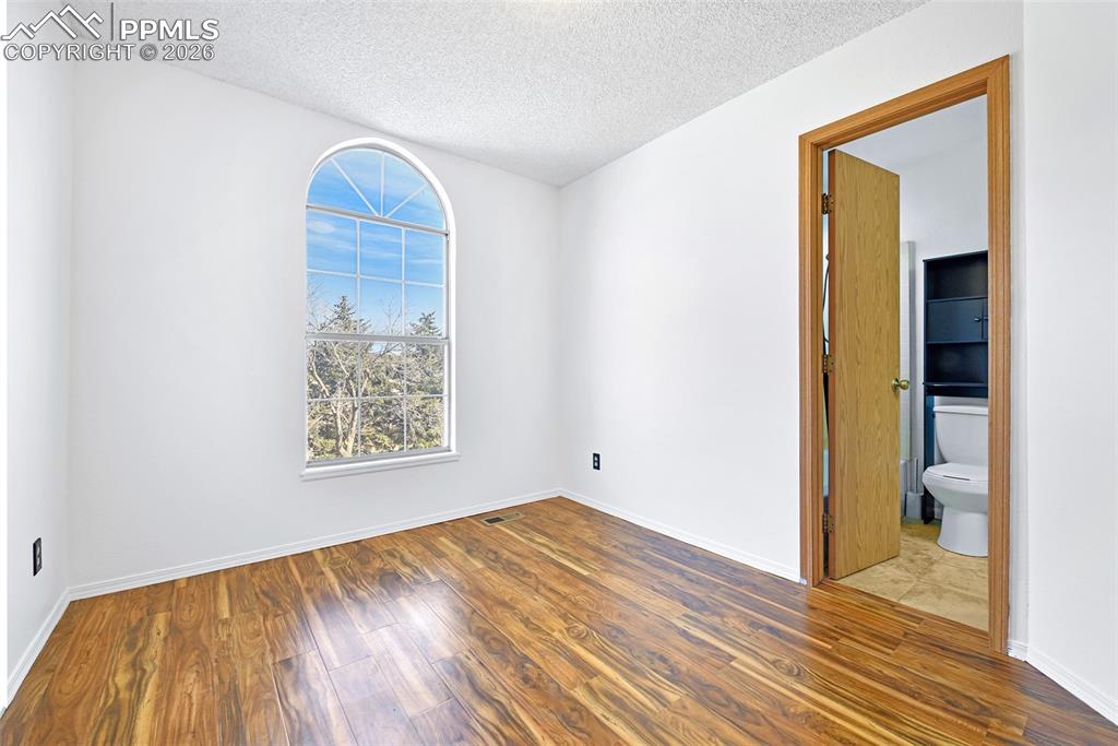 Bedroom #2 With View Into Bathroom- Upper Level