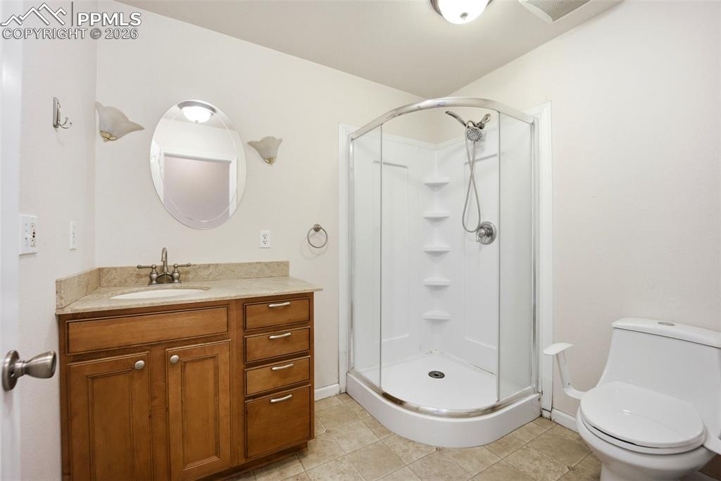 Main level full bathroom with shower stall