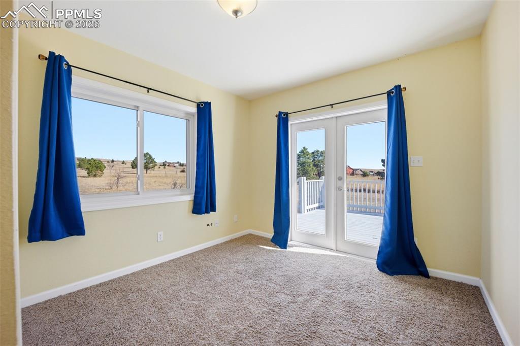 2nd main level bedroom, with french doors, and lots of light