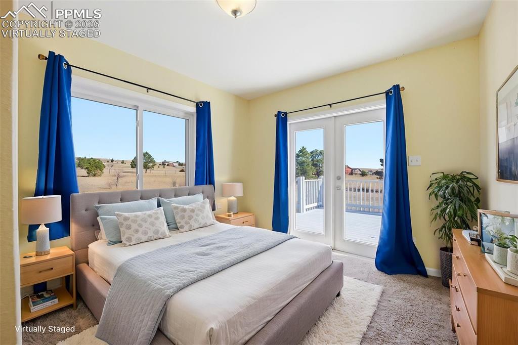 Virtually staged 2nd main level bedroom, with french doors, and lots of light