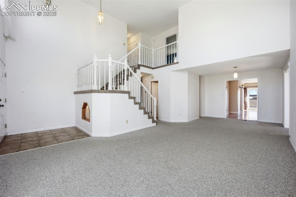 Living room with a high vaulted ceiling