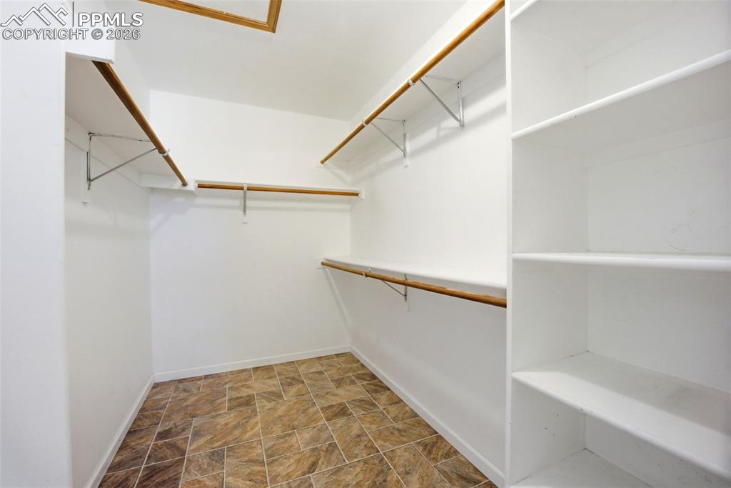 Primary bedroom walk in closet