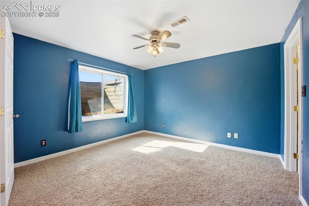 Basement bedroom with garden level window