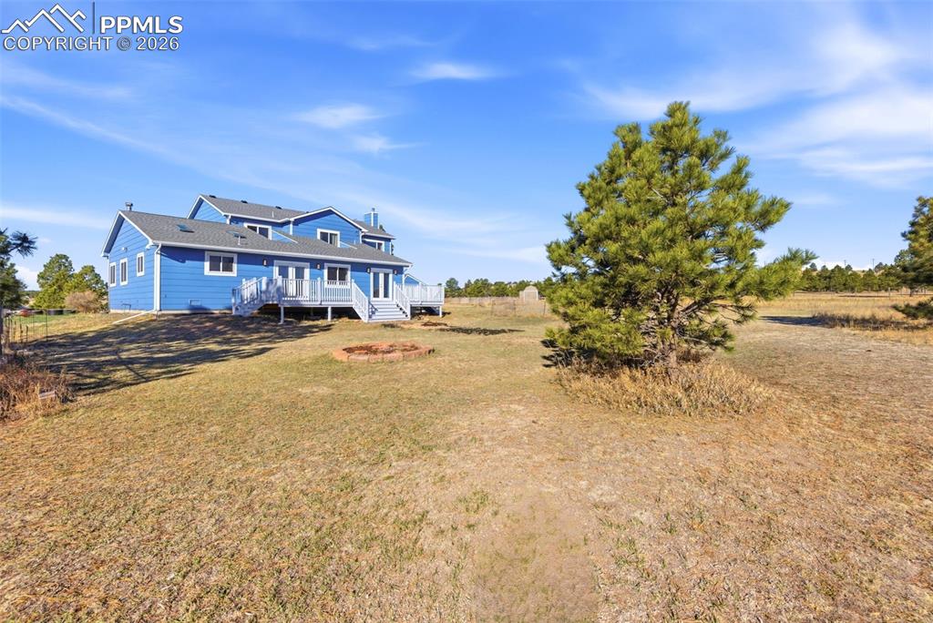 Rear view of house with a view of countryside