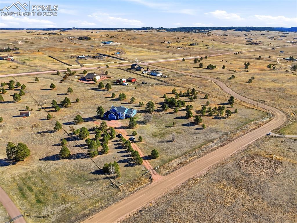 Aerial view of property and surrounding area with rural landscape