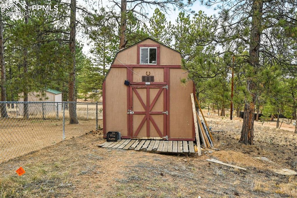 Shed included, tan shed in back is not part of property. 
