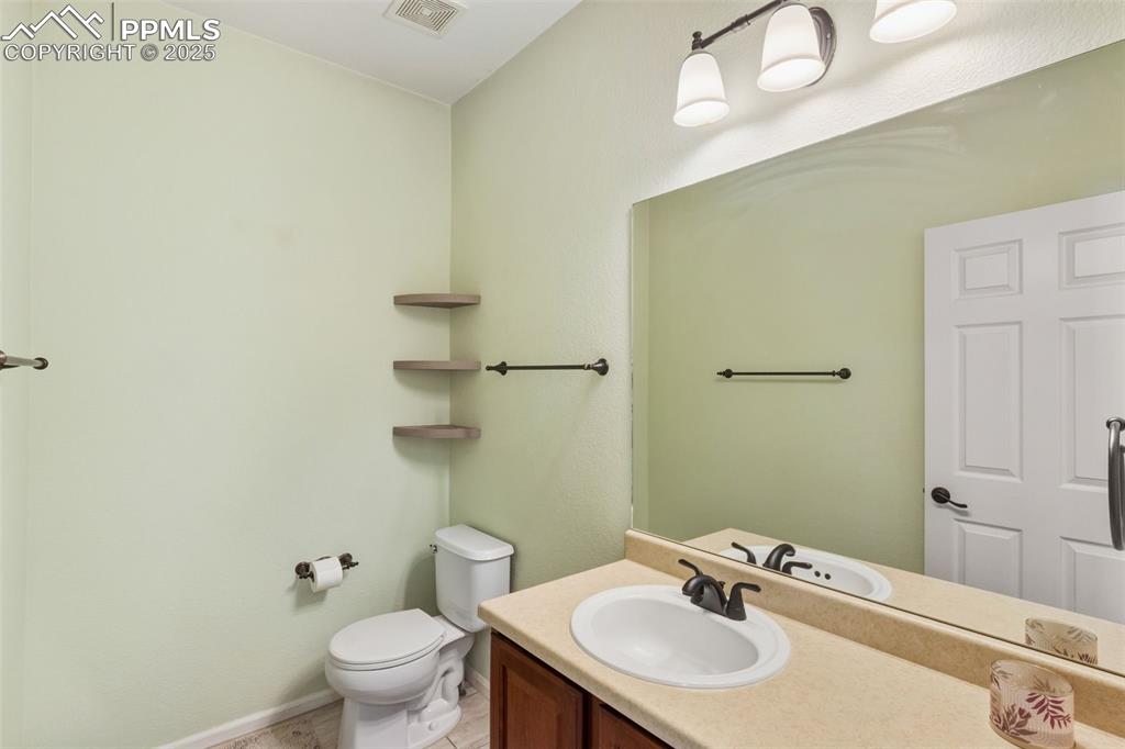 Bathroom with vanity and toilet