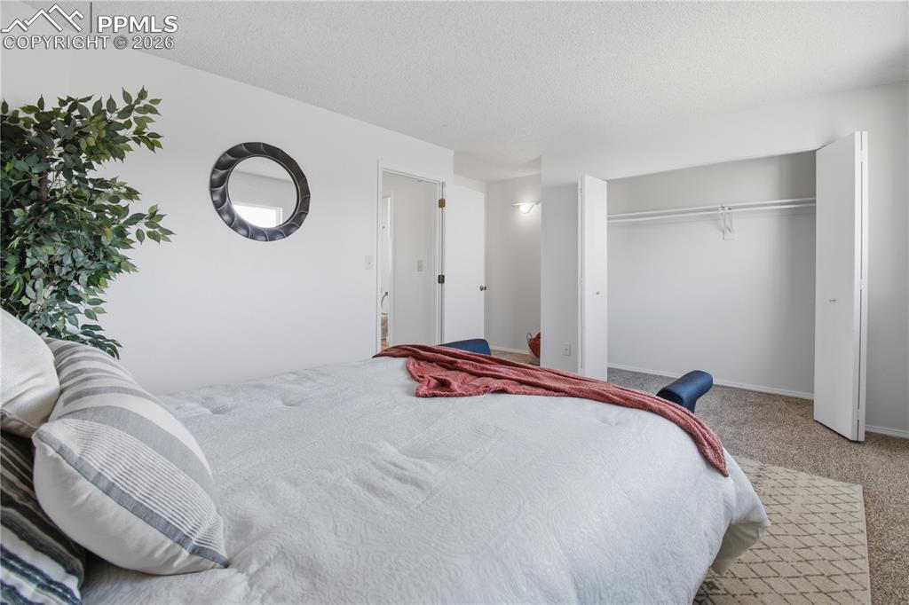 Primary Bedroom with large closet and entry into bathroom.