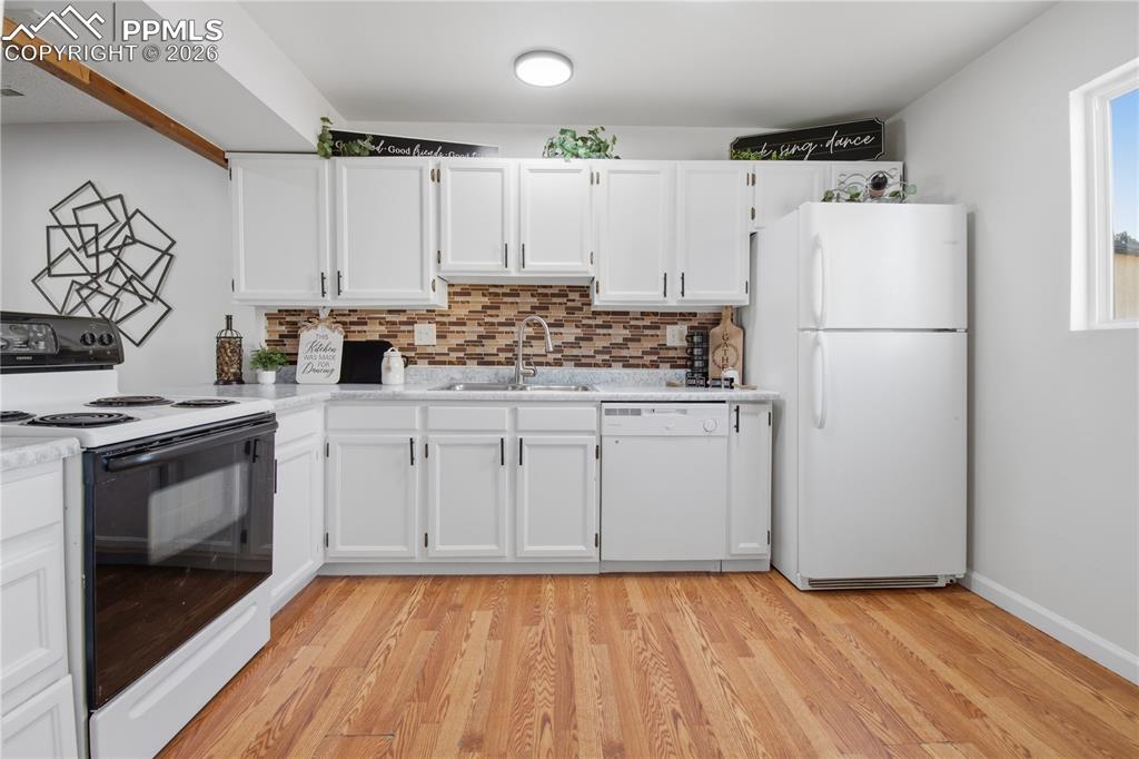 Freshly painted kitchen cabinets and new lighting