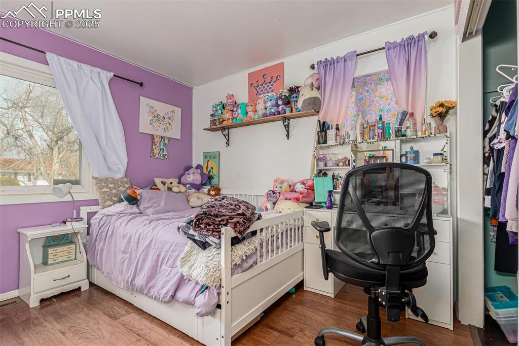 Bedroom with wood finished floors