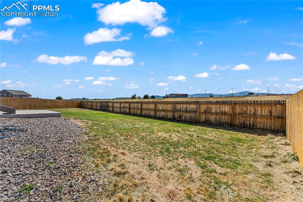 View of fenced backyard
