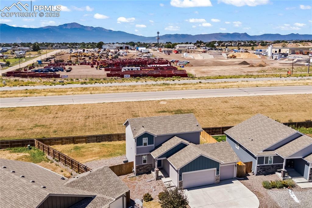 Aerial perspective of suburban area featuring a mountainous background