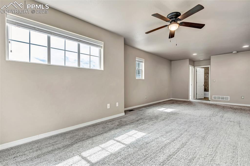 Unfurnished room with carpet, a ceiling fan, and recessed lighting