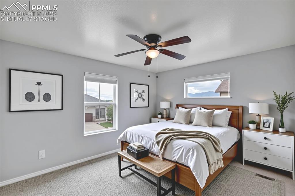 Virtually Staged - Secondary bedroom featuring carpet flooring and a ceiling fan