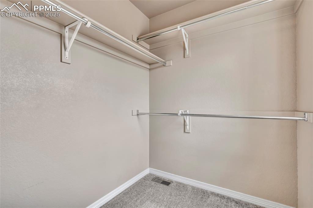 Spacious closet with a window in Secondary bedroom 