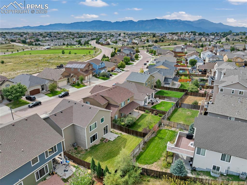 Aerial perspective of suburban area with mountains