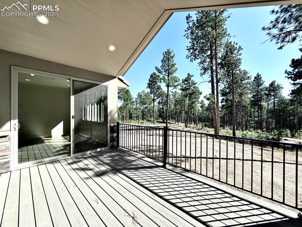 Oversized Sliding Doors to the Covered Composite Deck, featuring Natural Gas Line for Grilling and a Hose Bib for watering your favorite plants as you gaze into the forest.