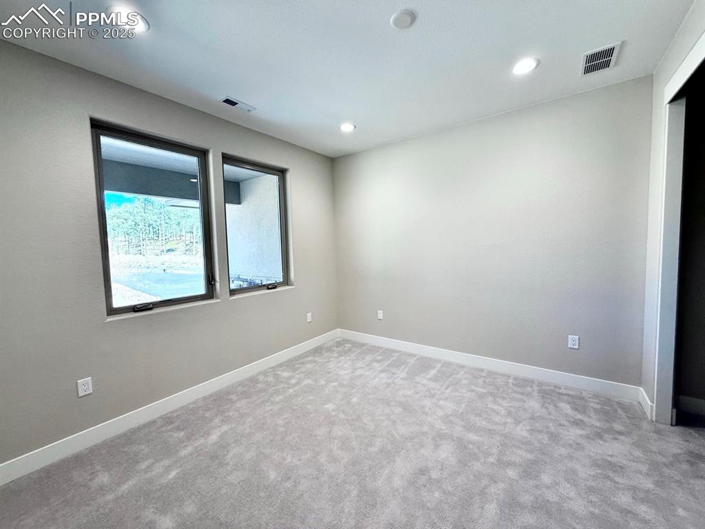 Second Bedroom with Large Closet and Carpeting.